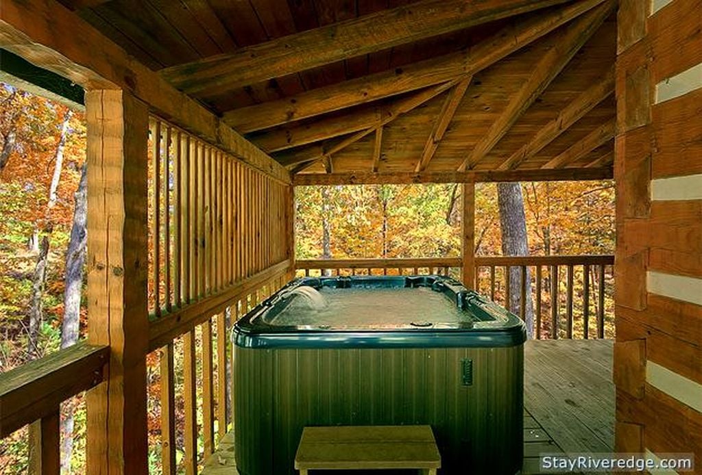 Deck view with hot tub at Woodland Wonder